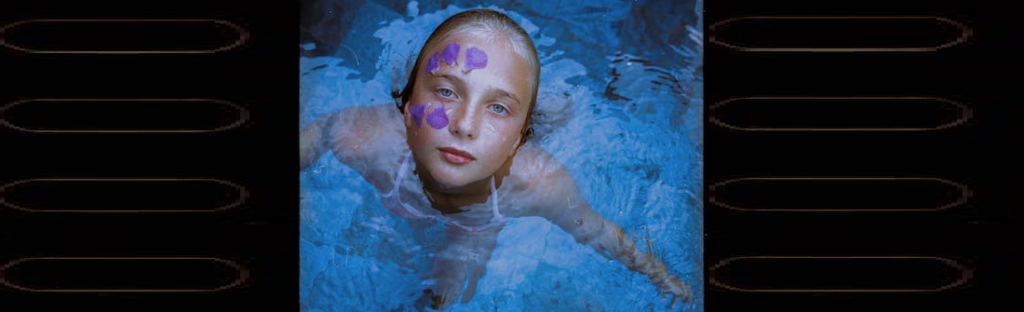 Girl with flower cap in pool